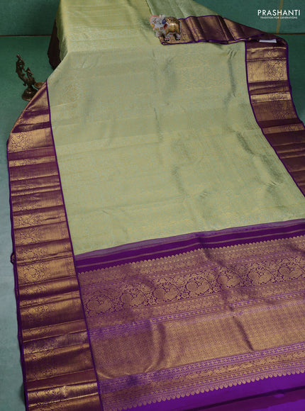 Pure kanchipuram silk saree pista green and violet with allover zari woven brocade weaves and zari woven korvai border
