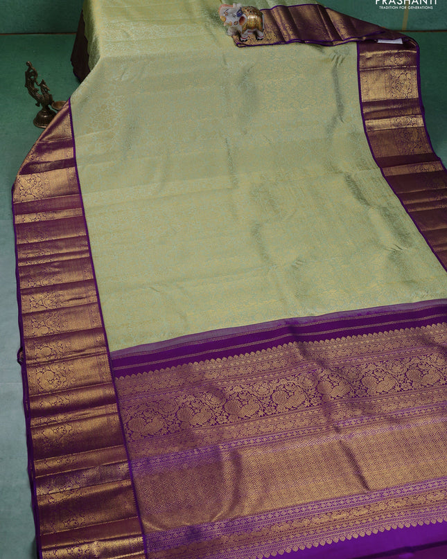 Pure kanchipuram silk saree pista green and violet with allover zari woven brocade weaves and zari woven korvai border