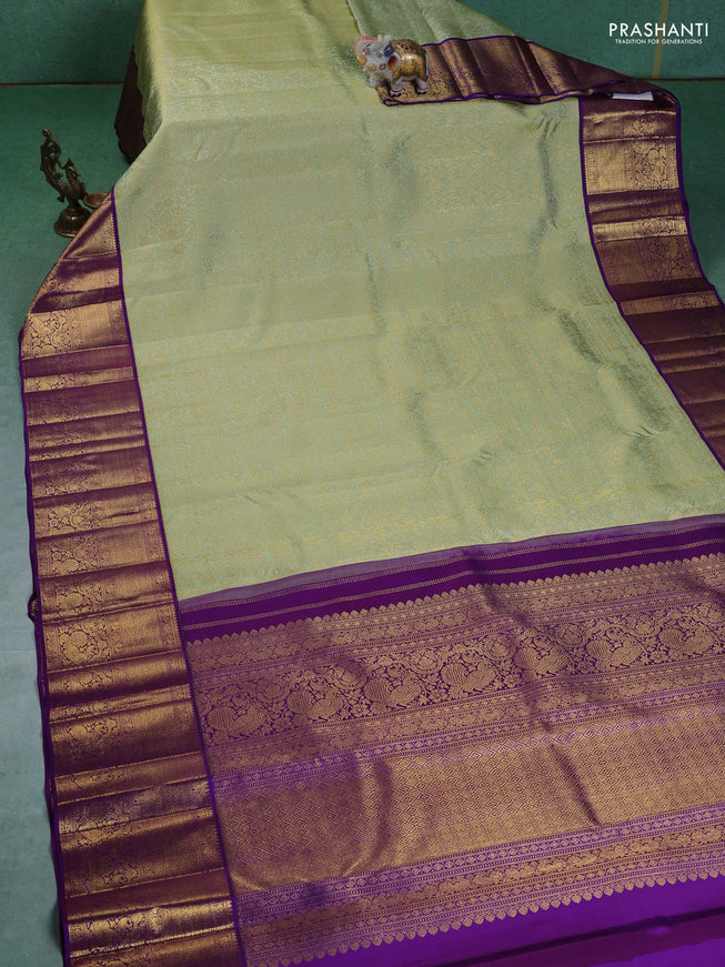 Pure kanchipuram silk saree pista green and violet with allover zari woven brocade weaves and zari woven korvai border
