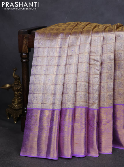 Pure kanchipuram silk saree gold and lavender with allover zari woven brocade weaves and zari woven korvai border