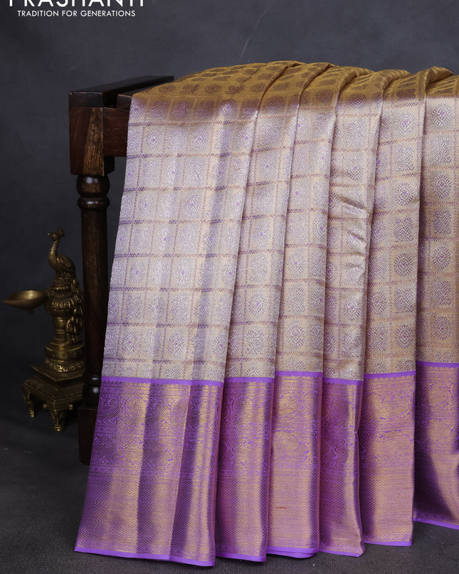 Pure kanchipuram silk saree gold and lavender with allover zari woven brocade weaves and zari woven korvai border