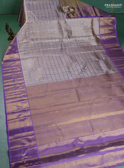 Pure kanchipuram silk saree gold and lavender with allover zari woven brocade weaves and zari woven korvai border
