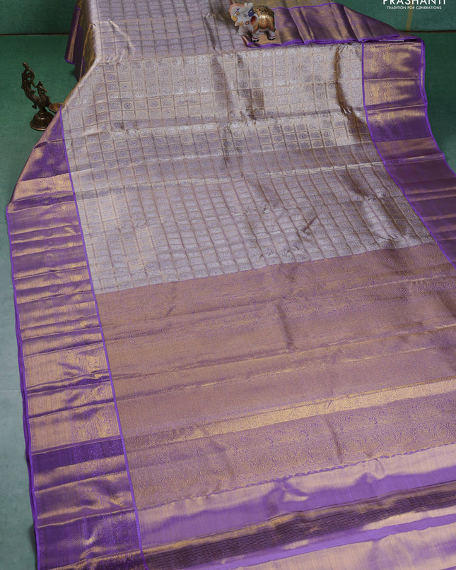 Pure kanchipuram silk saree gold and lavender with allover zari woven brocade weaves and zari woven korvai border
