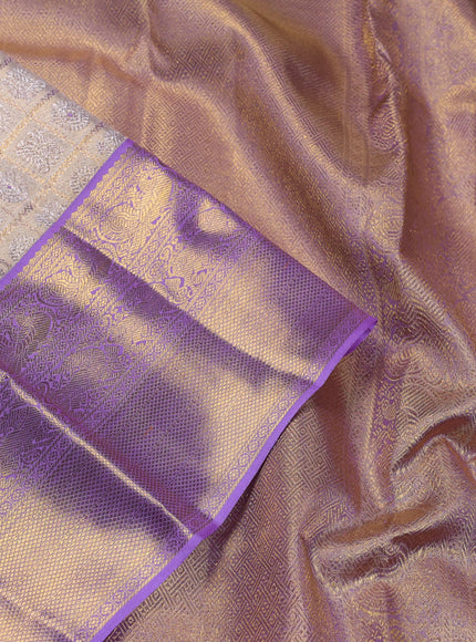 Pure kanchipuram silk saree gold and lavender with allover zari woven brocade weaves and zari woven korvai border