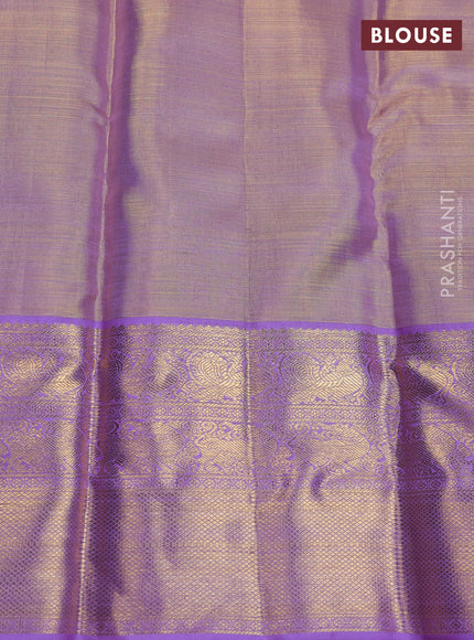 Pure kanchipuram silk saree gold and lavender with allover zari woven brocade weaves and zari woven korvai border