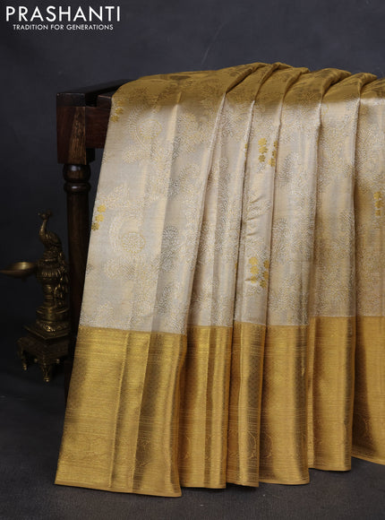 Pure kanchipuram silk saree gold and sandal with allover zari woven brocade weaves and zari woven korvai border