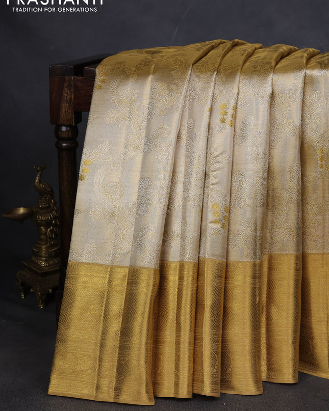 Pure kanchipuram silk saree gold and sandal with allover zari woven brocade weaves and zari woven korvai border