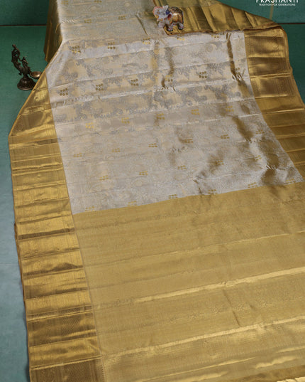 Pure kanchipuram silk saree gold and sandal with allover zari woven brocade weaves and zari woven korvai border