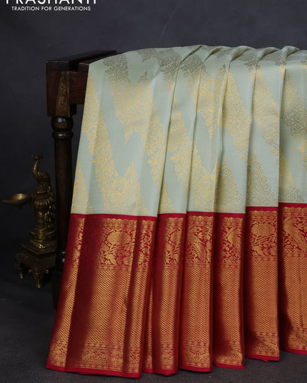 Pure kanchipuram silk saree pista green and maroon with allover zari woven brocade weaves and long zari woven border