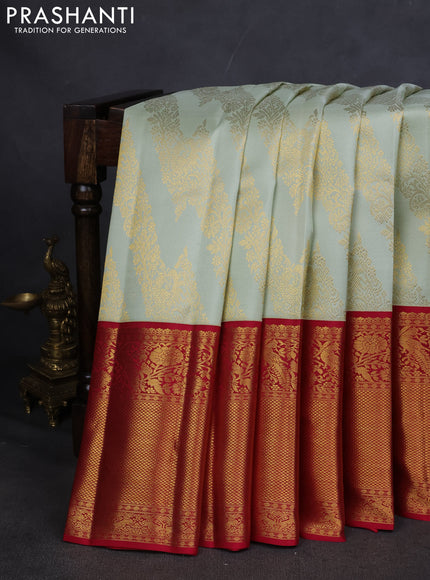 Pure kanchipuram silk saree pista green and maroon with allover zari woven brocade weaves and long zari woven border