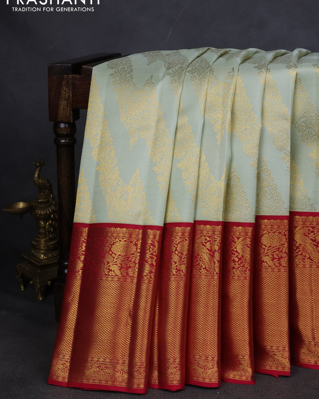 Pure kanchipuram silk saree pista green and maroon with allover zari woven brocade weaves and long zari woven border