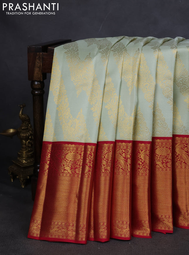 Pure kanchipuram silk saree pista green and maroon with allover zari woven brocade weaves and long zari woven border