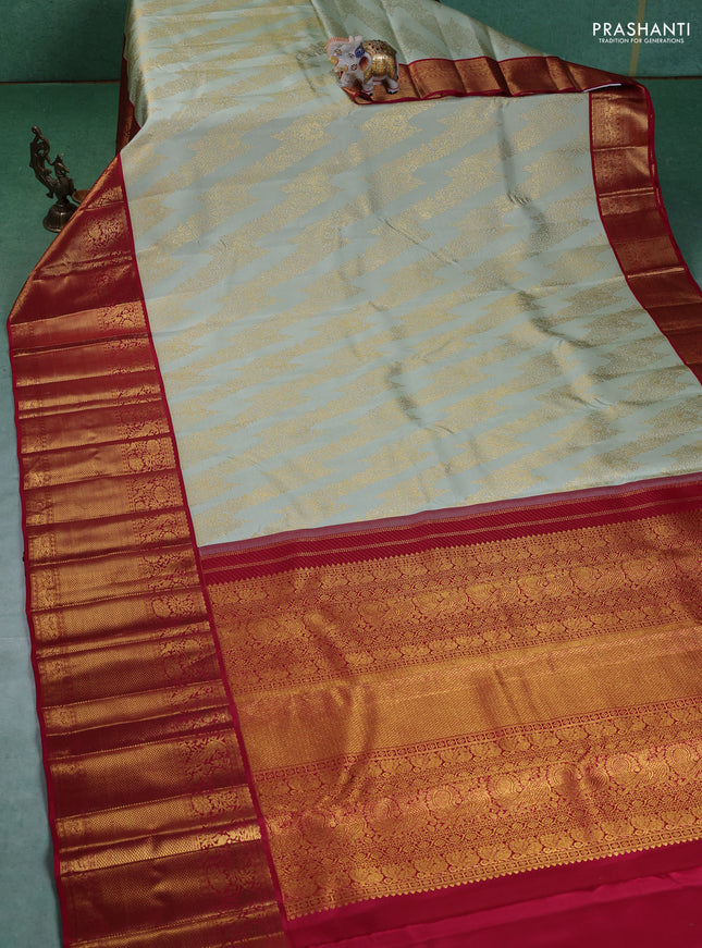 Pure kanchipuram silk saree pista green and maroon with allover zari woven brocade weaves and long zari woven border