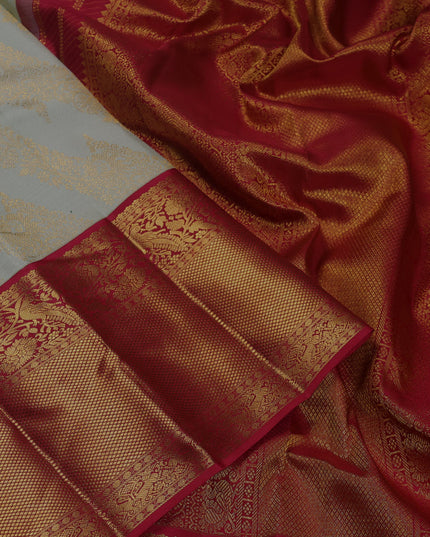 Pure kanchipuram silk saree pista green and maroon with allover zari woven brocade weaves and long zari woven border