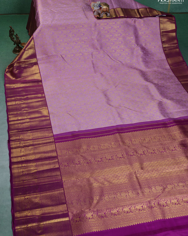 Pure kanchipuram silk saree lavender and purple with allover zari woven brocade weaves and long zari woven border