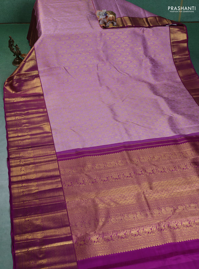 Pure kanchipuram silk saree lavender and purple with allover zari woven brocade weaves and long zari woven border