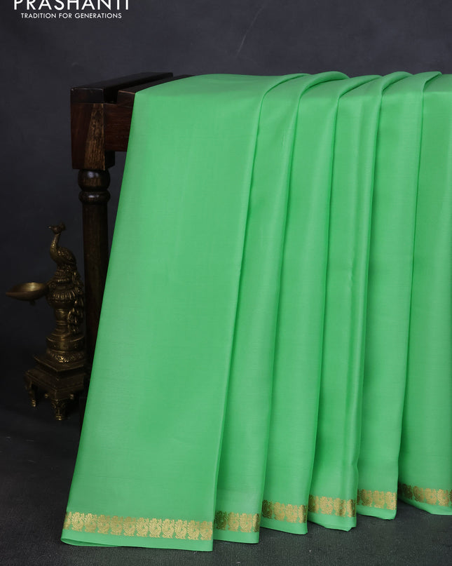 Pure mysore silk saree pista green with plain body and small zari woven border