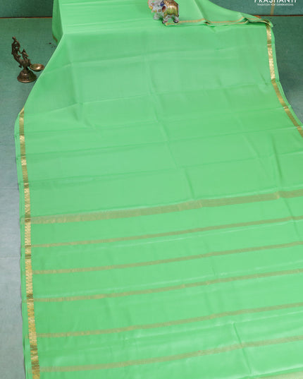Pure mysore silk saree pista green with plain body and small zari woven border