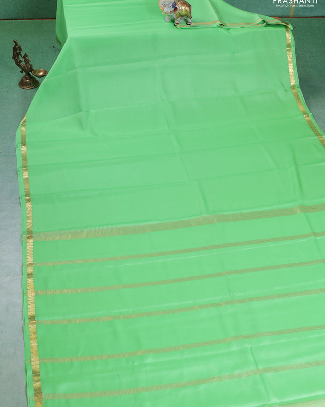 Pure mysore silk saree pista green with plain body and small zari woven border