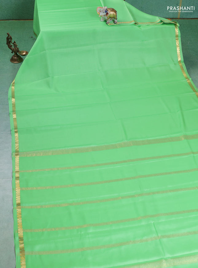 Pure mysore silk saree pista green with plain body and small zari woven border