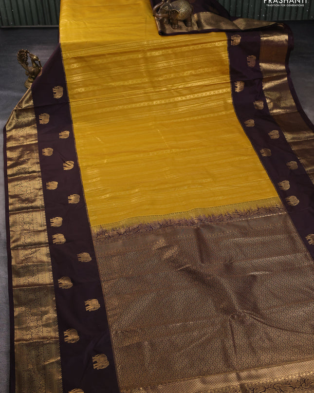 Bangalori silk saree mustard yellow and coffee brown with allover zari weaves and elephant butta border
