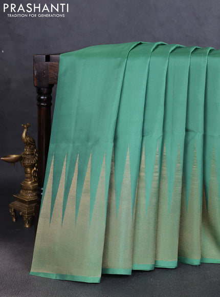 Pure soft silk saree pastel green with plain body and temple design zari woven border