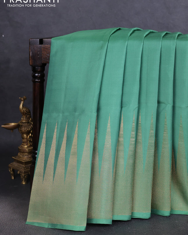 Pure soft silk saree pastel green with plain body and temple design zari woven border