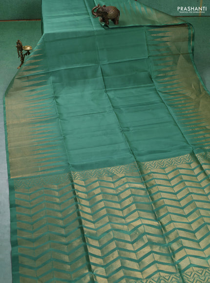 Pure soft silk saree pastel green with plain body and temple design zari woven border
