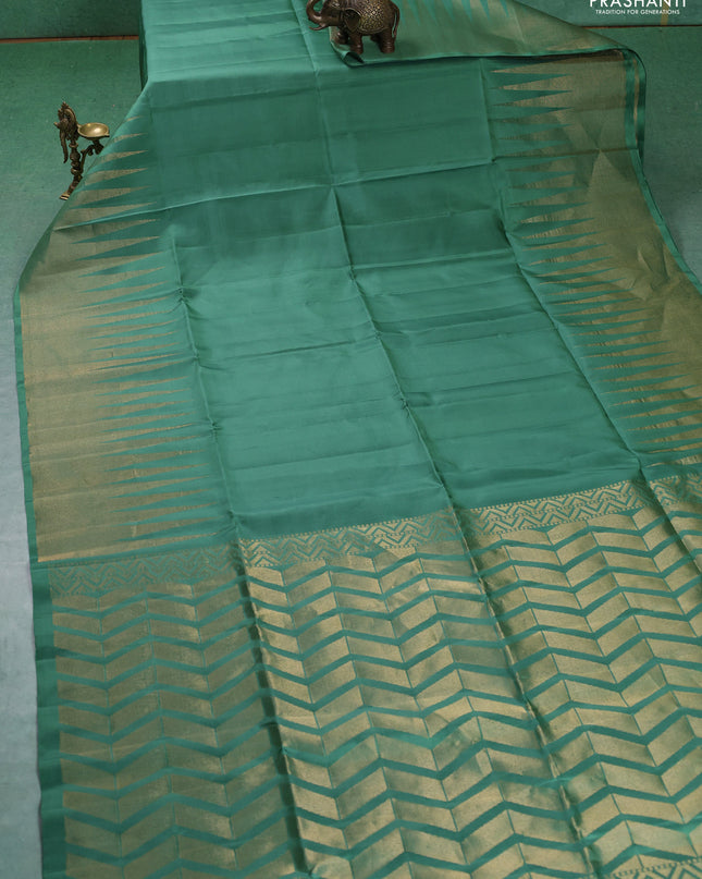 Pure soft silk saree pastel green with plain body and temple design zari woven border