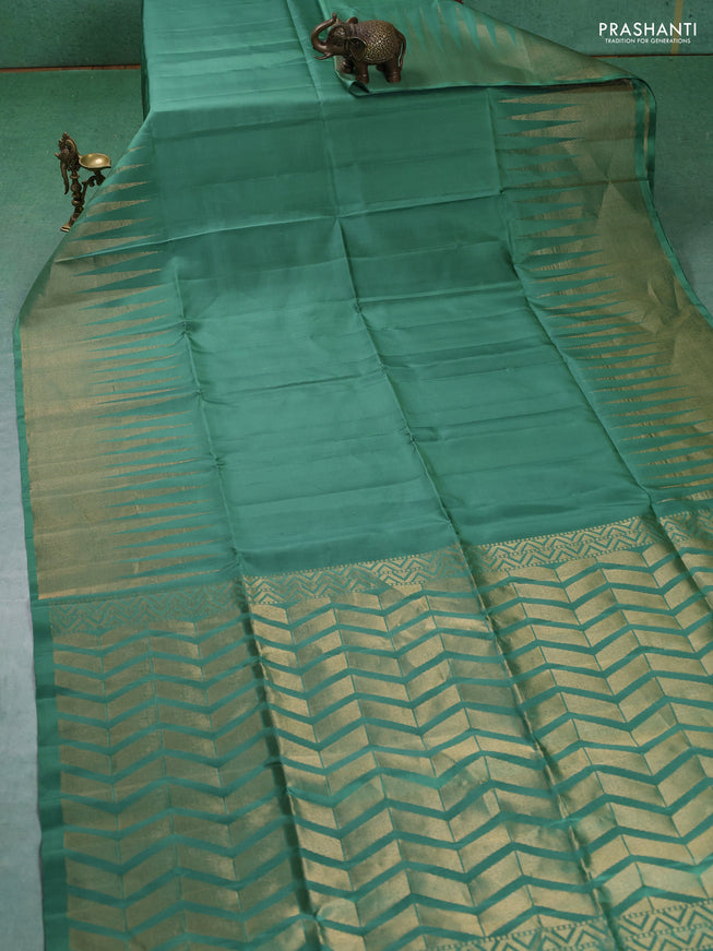 Pure soft silk saree pastel green with plain body and temple design zari woven border