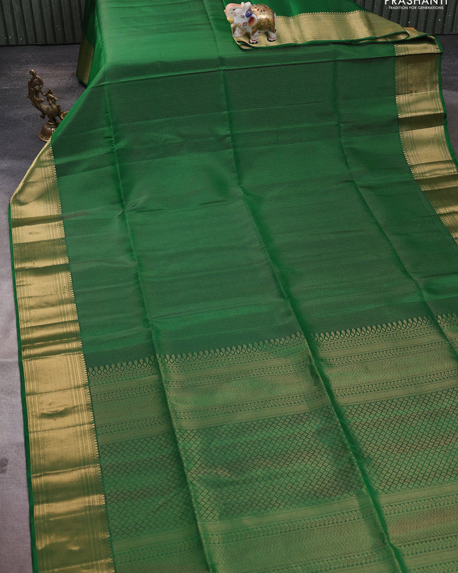 Pure soft silk saree green with allover zari weaves and zari woven border