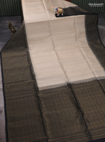 Pure soft silk saree beige and black with allover zari woven brocade weaves and zari woven border