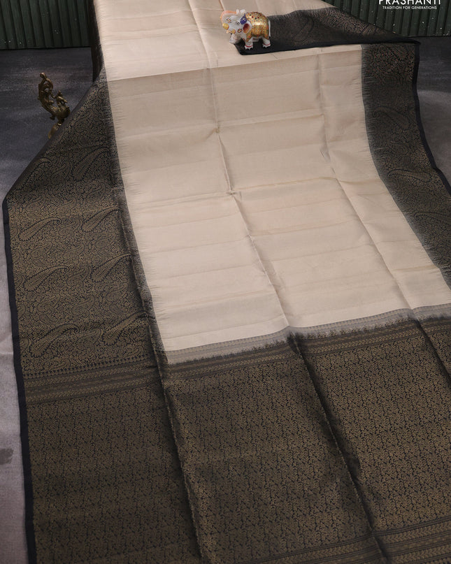 Pure soft silk saree beige and black with allover zari woven brocade weaves and zari woven border