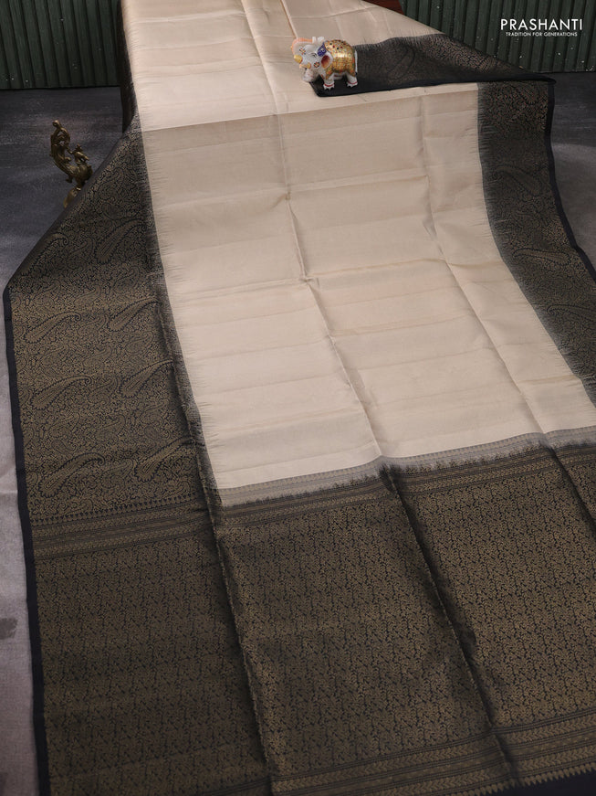 Pure soft silk saree beige and black with allover zari woven brocade weaves and zari woven border