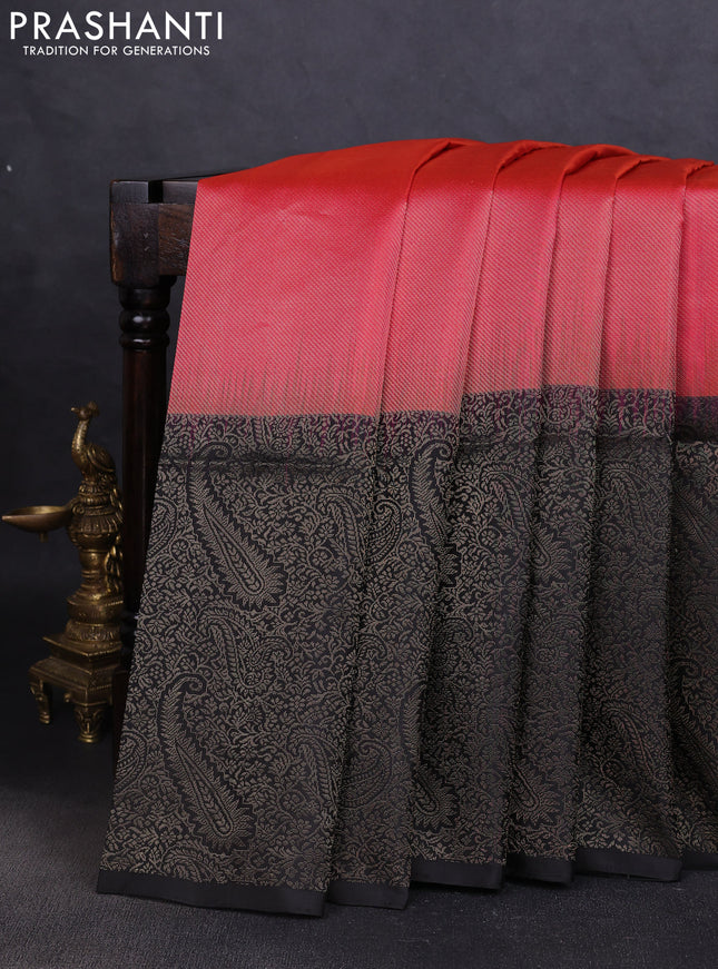 Pure soft silk saree dual shade of pinkish orange and black with allover zari woven brocade weaves and zari woven border