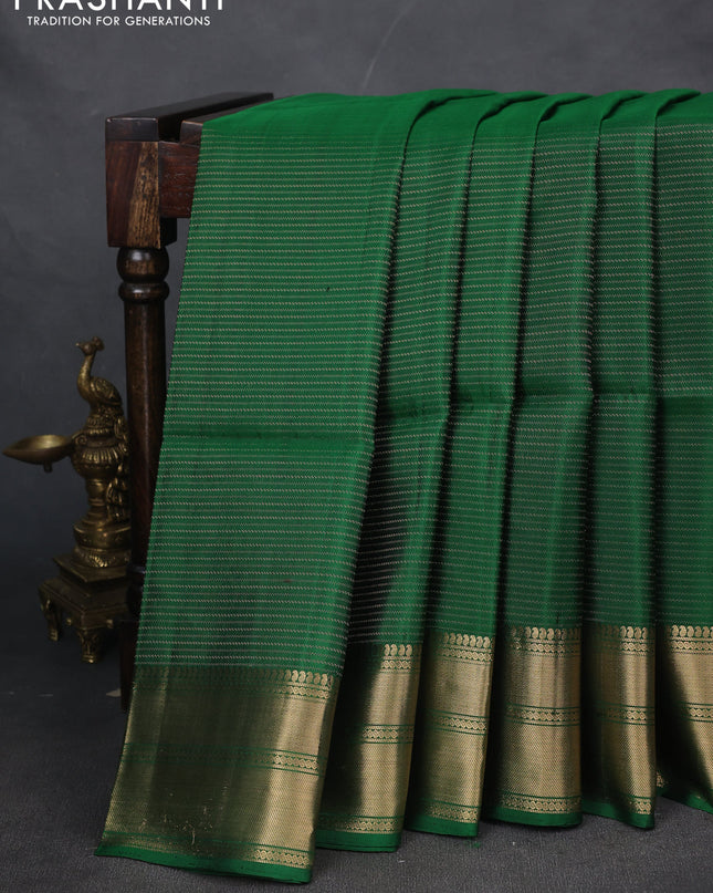 Pure soft silk saree green with allover zari weaves and zari woven border