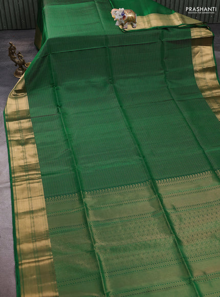 Pure soft silk saree green with allover zari weaves and zari woven border