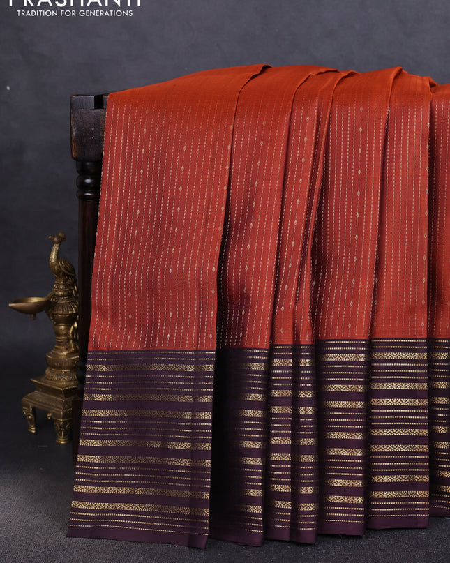 Pure soft silk saree rustic orange and deep wine with allover zari weaves and zari woven border