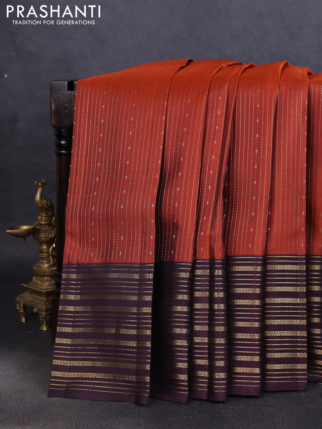 Pure soft silk saree rustic orange and deep wine with allover zari weaves and zari woven border