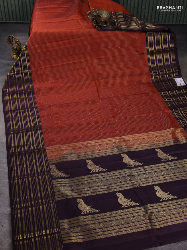 Pure soft silk saree rustic orange and deep wine with allover zari weaves and zari woven border