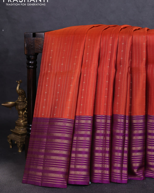 Pure soft silk saree rustic orange and purple with allover zari weaves and zari woven border