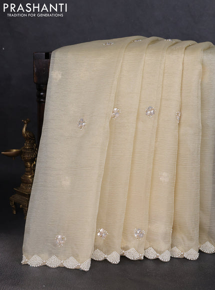 Crush tissue saree pale yellow with beaded work and beaded border