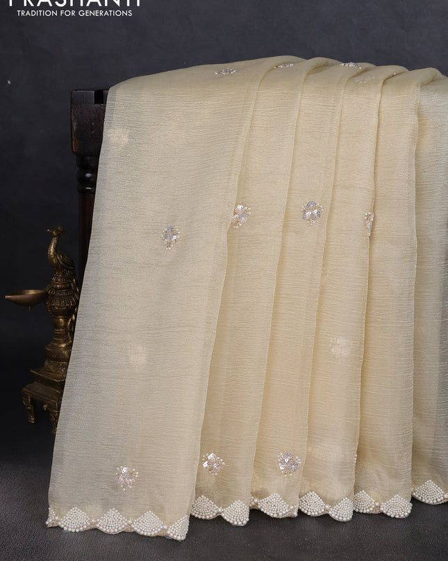 Crush tissue saree pale yellow with beaded work and beaded border
