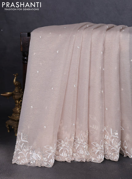 Crush tissue saree grey and wiith allover sequin work and embroidery border