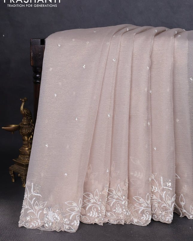 Crush tissue saree grey and wiith allover sequin work and embroidery border