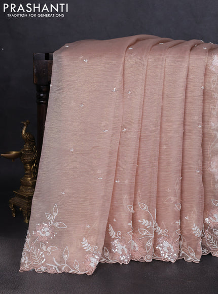 Crush tissue saree mild peach and wiith allover sequin work and embroidery border