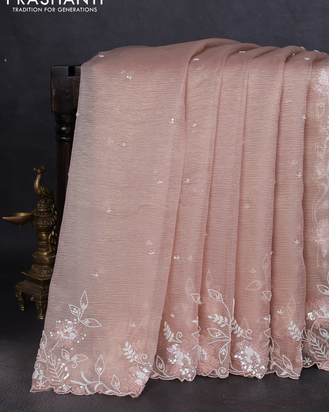 Crush tissue saree mild peach and wiith allover sequin work and embroidery border