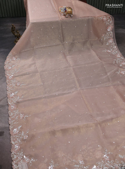Crush tissue saree mild peach and wiith allover sequin work and embroidery border