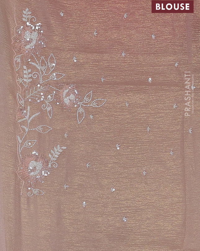 Crush tissue saree mild peach and wiith allover sequin work and embroidery border