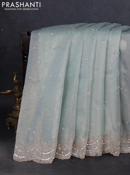 Crush tissue saree pastel blue and wiith allover sequin work and embroidery border